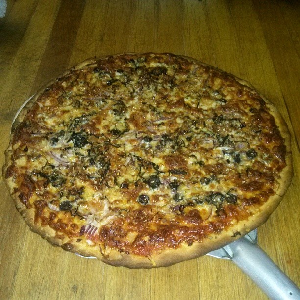 Bacon fat infused pizza dough topped with fresh garlic, black olives, red onions, basil & more BACON. - from Instagram